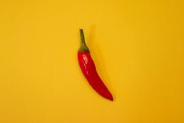 En red hot chilli som symboliserar Extra Chilli Epic Spins från Evolution